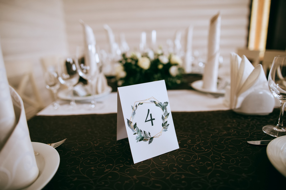 Wedding table with white flowers with table number. Wedding decoration